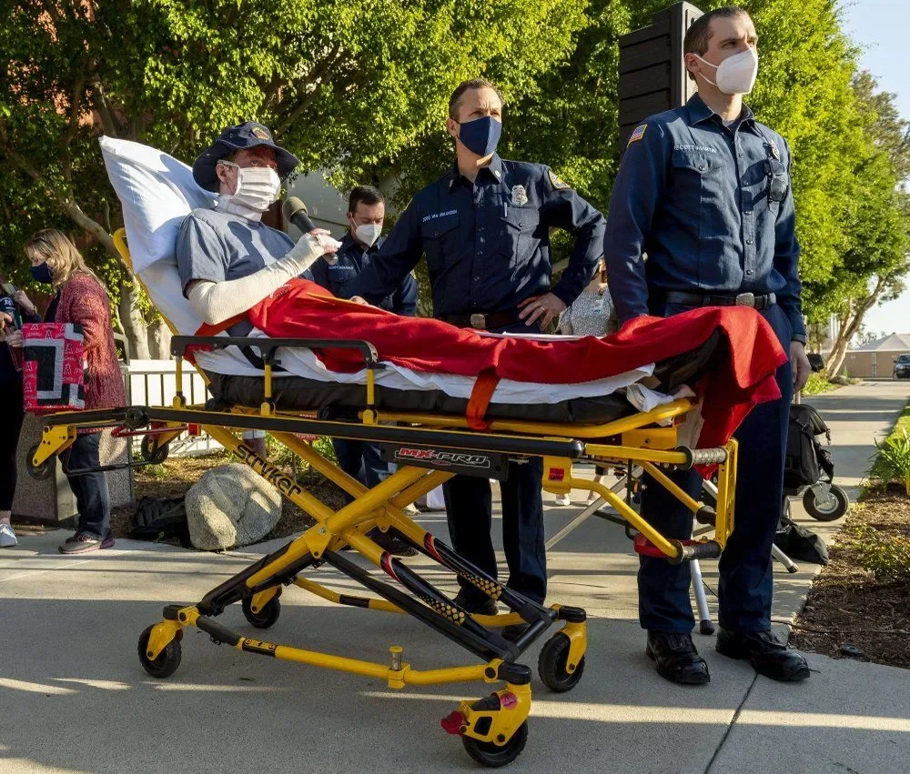 Burned firefighter leaves southern california hospital to cheers